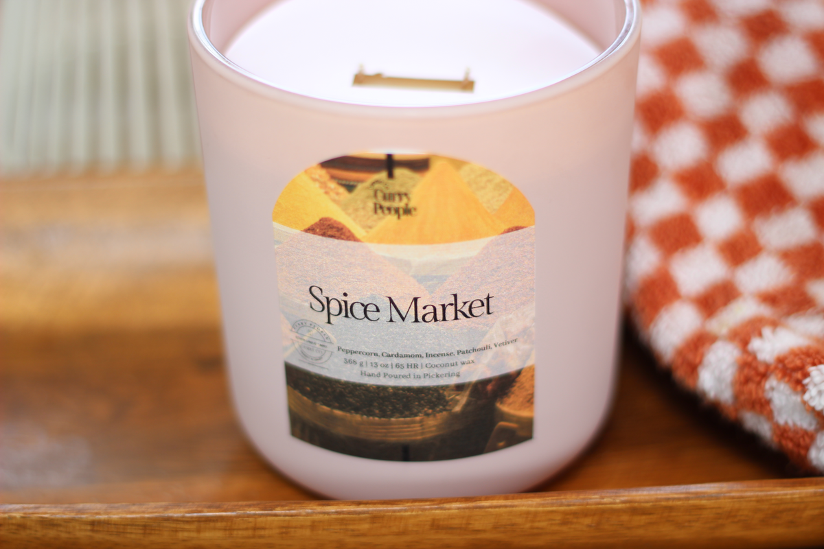 13 oz Spiced Market candle in its matte glass jar