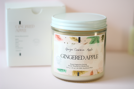 Gingered Apple candle with a decorative label on a light background