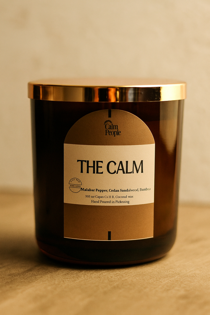 Candle labeled 'The Calm' by Palm People on a beige background