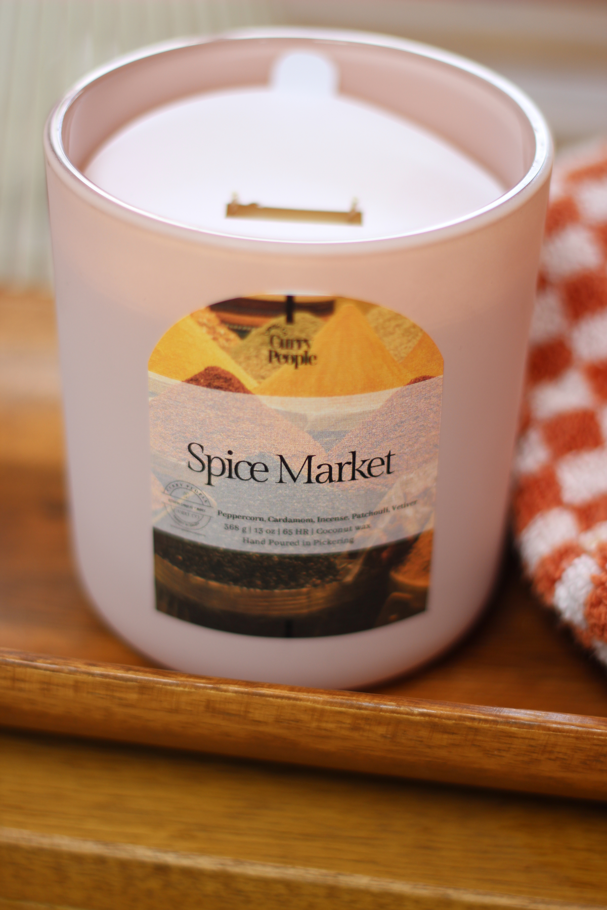 Spiced Market coconut wax candle in a 13 oz matte glass jar
