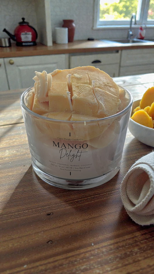Jar of 'Mango Delight' on a wooden table with a kitchen background